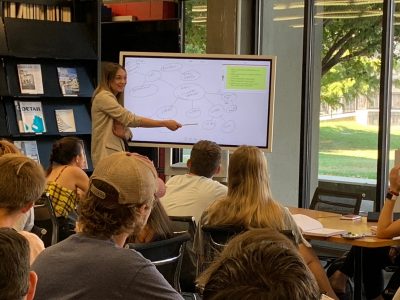 Students learning about the research process in the Art & Architecture Library from Cathryn Copper, Head Librarian.