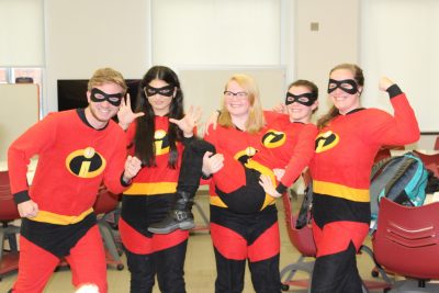 Transfer students dressed as "The Incredibles" for CHEM 1004 on Halloween.